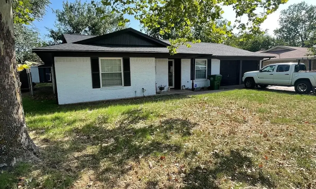 Professional roofing crew working on a residential roof in Lebanon